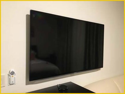 A wall-mounted TV showcasing the TV mounting service offered by the repair shop in Palm Coast for customers in Flagler County.