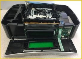 A Bose surround system consisting of multiple speakers and a subwoofer placed on a table for Hi-Fi repair service at our Flagler County repair shop.