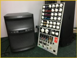 A SubWoofer and Amplifier on a table, both in need of repair services at a Hi-Fi repair shop in Flagler County.