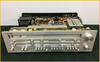 This image shows a vintage receiver, features knobs, switches, and dials for adjusting volume, tuning, and other audio settings. Our repair shop offers expert repair services for vintage hi-fi equipment like this receiver, so you can enjoy high-quality audio from your classic equipment once again.